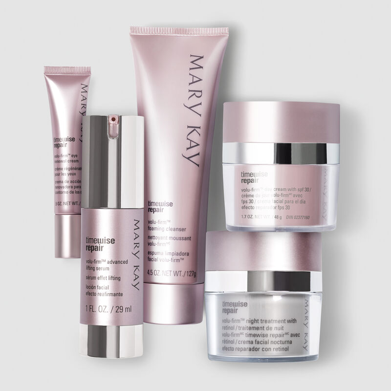 The Mary Kay TimeWise Repair Volu-Firm Set against a gray background.
