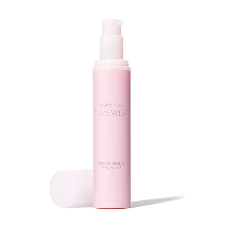 Uncapped bottle of TimeWise Replenishing Serum C + E from the Best-in-Brightness Bundle standing against a plain background next to its cap 