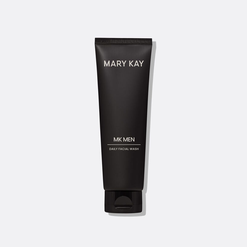 Bottle of MKMen Daily Facial Wash standing on its cap against a plain background