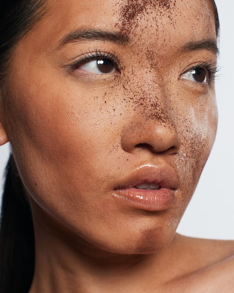 Close-up of a model with makeup powder on her face