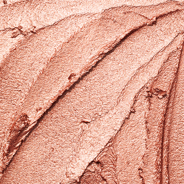 Primer plano de una muestra de textura dorada de la Sombra de Ojos Brillante en Barra Mary Kay&reg;.